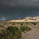 Emigrant Peak highways 95 hwy 6 under storm clouds with a rainbow nevada great basin.