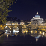 St. Peter's Cathedral in Rome, Italy, at night  from the Tiber River.